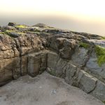 Mossy rock at rocky beach scan (II)