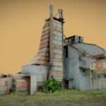 Abandoned factory with tall tower